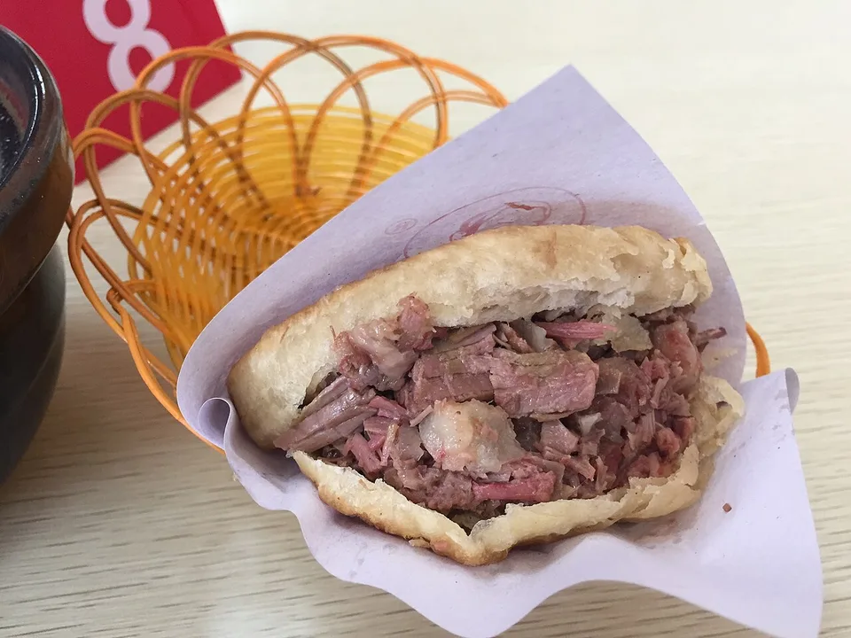 A Baoding-style donkey-meat sandwich in its baked flatbread.
