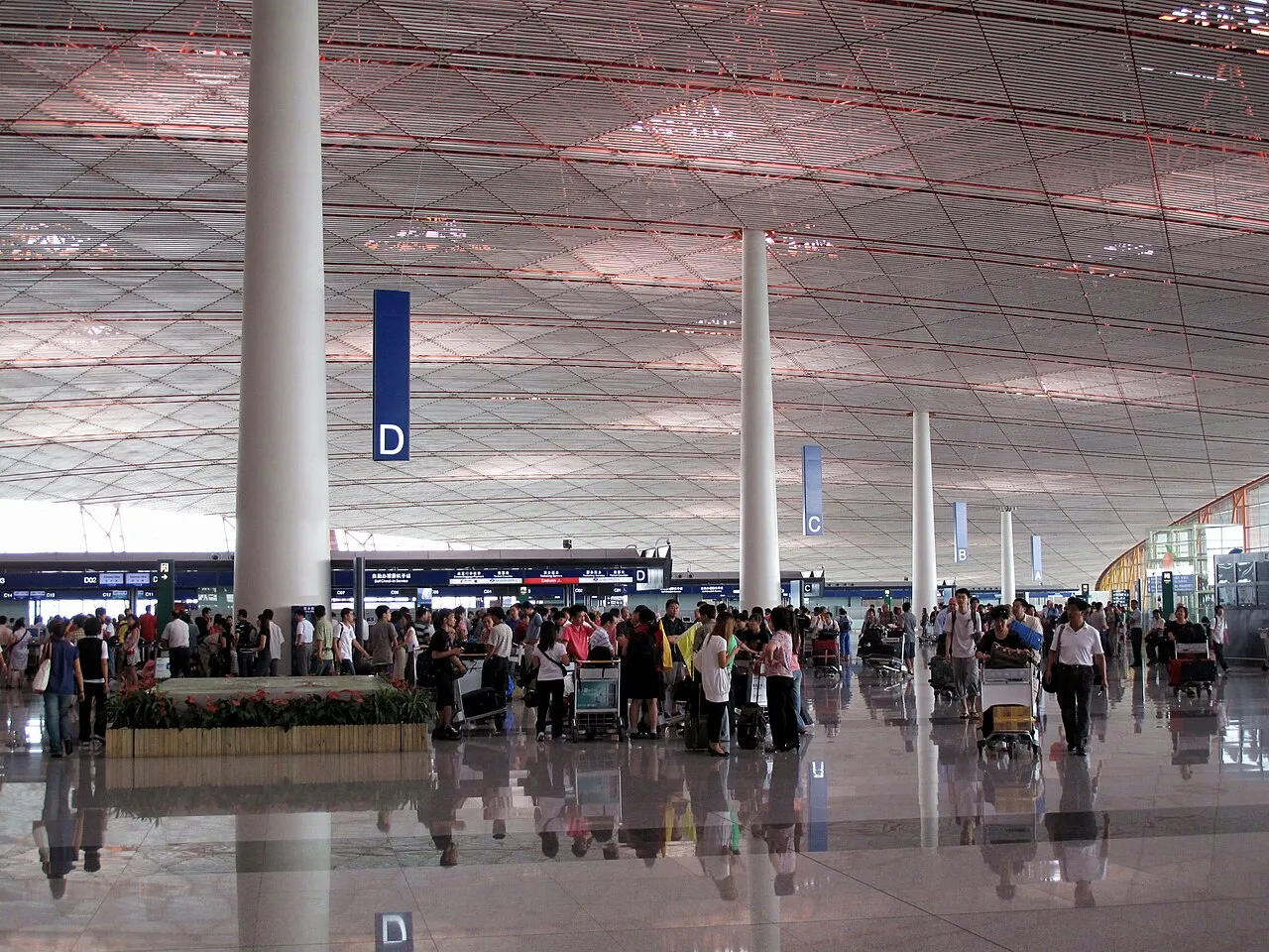 The interior of Beijing Capital International Airport, Terminal 3, photographed in 2009. A setting photograph for your arrival preparations.