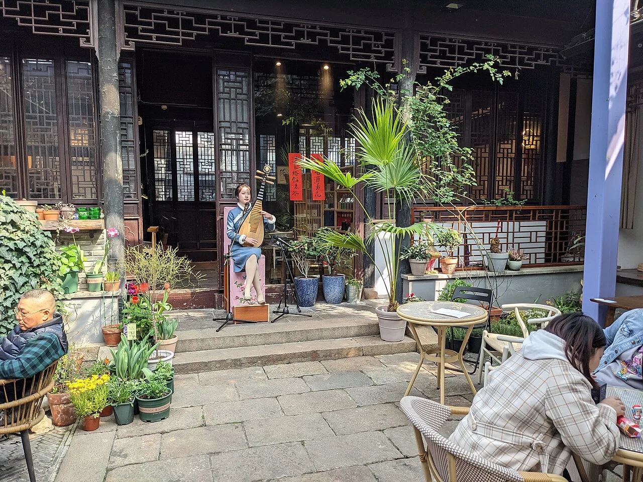 A pingtan performer with a stringed instrument in a Pingjiang Road teahouse.