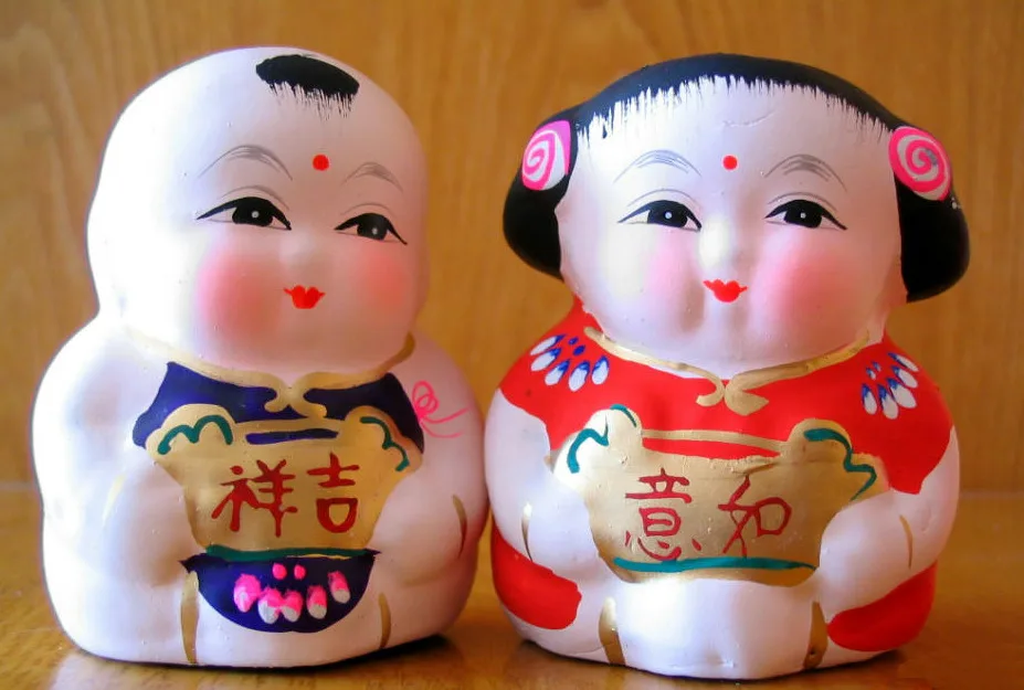 Colorful Huishan clay figures displayed together.